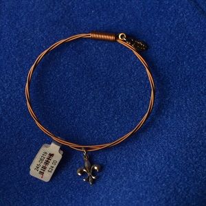 Guitar string bracelet with flour de lis charm